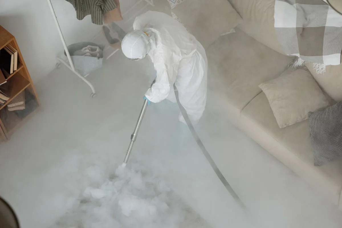 Biohazard cleanup technician in protective equipment, Salmon Brook, CT